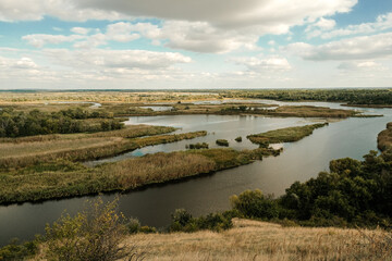 River landscape from a hill to a river valley in summer.