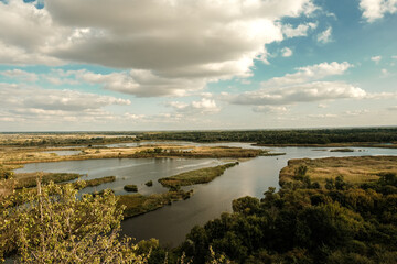 River landscape from a hill to a river valley in summer.