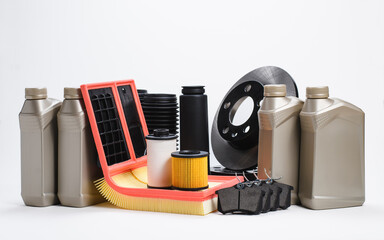 Motor oil, filters and spare parts for cars on a white background. Auto parts store.