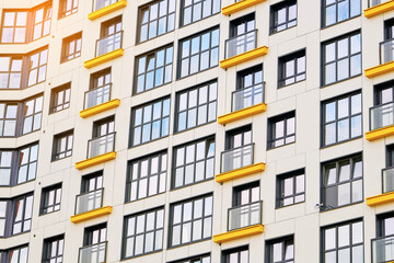 Obraz premium Detail of new residential apartment building exterior, modern design, real estate property for sale. Residential apartment building complex. Cityscape