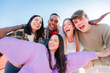 Group of real multiracial teenagers having fun together and posing for a portrait. Young friends...