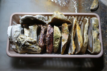 Collectible samples of stones after sawing with a diamond blade in a stone-cutting workshop