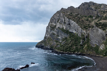 Seongsan Ilchulbong Sunrise Peak is a mountain in Seongsan-ri, Seongsan-eup, Seogwipo, Jeju Special Self-Governing Province. Featuring a large bowl-shaped crater, the interior area of the crater is 12
