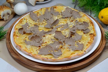 Gourmet truffle pizza on wooden board