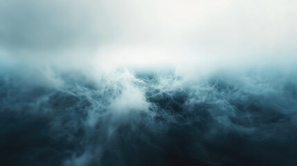 Fototapeta premium The image is of a large body of water with a lot of white foam and waves. The water appears to be rough and choppy, giving the impression of a stormy sea. Scene is one of power and unpredictability
