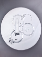 a white spray can on a light background with crystal branches next to it