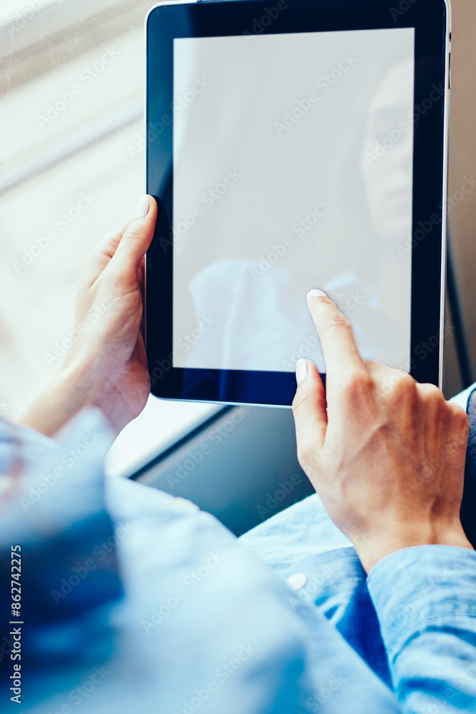 Poster woman's hands holding tablet with mock up screen for advertisement and installing application via fr