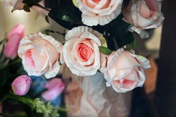 Pink roses in white vase, ideal for flower arranging or weddings