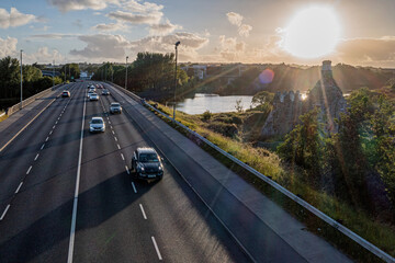 Galway scene: traffic flows over the Quincentennial Bridge near Terryland Castle at sunset