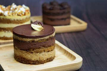 The classic French Opera Cake is made with layers of almond sponge,  coffee syrup, French buttercream, and chocolate ganache. This healthy mini cake is vegan, gluten free, and refined sugar free.