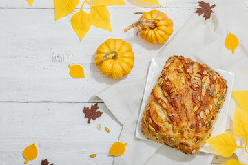 Fresh bread with pumpkin seeds. Home baking concept. Autumn decor
