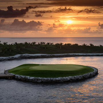a captivating illustration of a breathtaking par 3 golf course adorned with an island green against sunset backdrio.