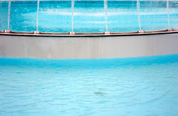 Large fountain with two pools and jets of water. Splashing water in fountain.