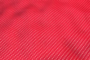 Light shining on brushed red metal plate texture, abstract background. Pattern texture crumpled white fabric background