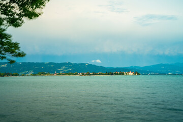 Germany, Lindau island village houses, bodensee lake water panorama, view to austrian mountains, alps, pfaender and nature landscape