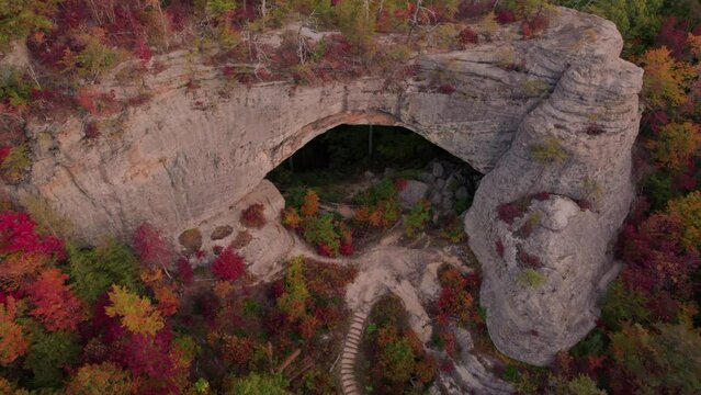 Epic Natural Bridge Cave with Stairs. Drone Back to Reveal Stone Formation to Sunset Forest Scenery. Kentucky Forest Tourist Destination
