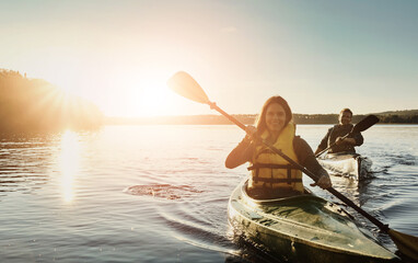 Couple, happy and lake outdoor for kayak or water sports in nature, paddling and rowing together...