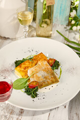 Delicious Battered Pike with Potato Gratin in Sunlit Rustic Setting - Stock Food Photography
