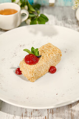 Napoleon Pastry with Berry Sauce in Sunlit Rustic Setting