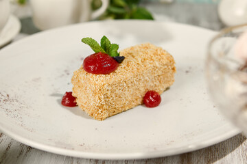 Classic Napoleon Pastry with Berry Sauce in Sunlit Rustic Setting