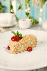 Napoleon Pastry with Berry Sauce Under Sunlight on Wooden Surface