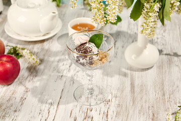 Scoop of Ice Cream in Sunlit Dish on Rustic Wooden Table