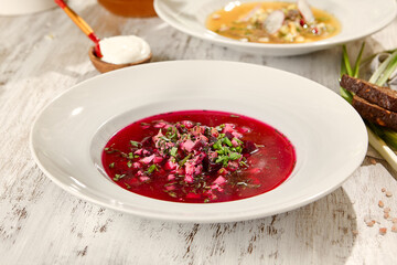 Chilled Beetroot Soup in White Bowl on Wooden Table with Sunlight