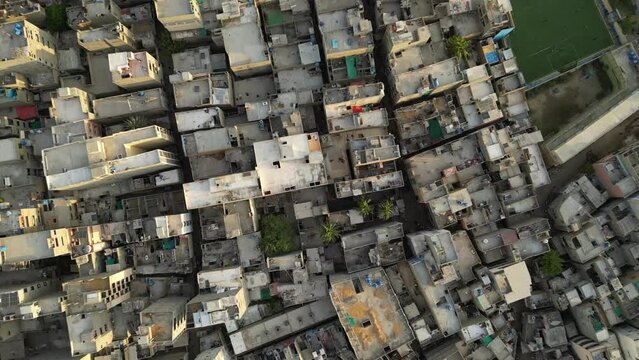 Aerial view of densely packed rooftops in Lyari, Karachi, Pakistan.