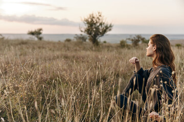 Solitude in nature woman contemplating life in vast open field