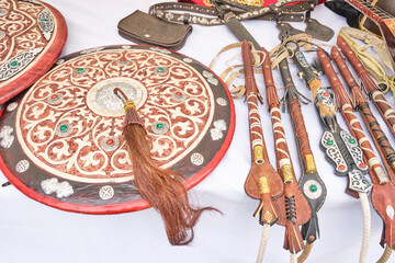 Traditional medieval shields of ancient Asian warrior and kazakh lashes for horses