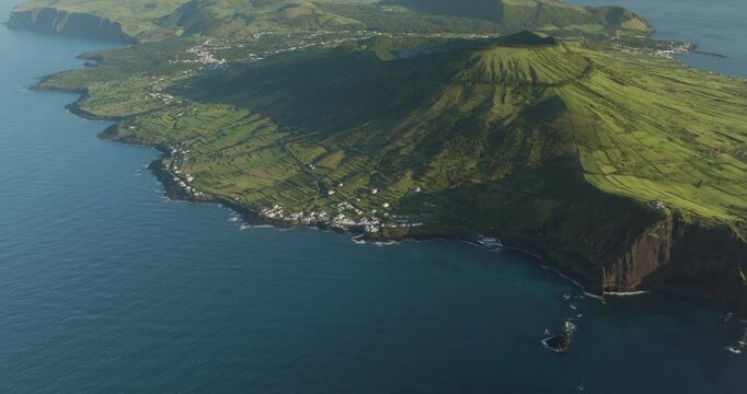 Aerial view of scenic Graciosa Island with green mountains and cliffs overlooking the ocean, Luz, Azores, Portugal.