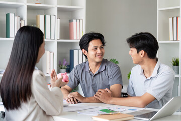 Gay Couple Planning Finance and Investments with Financial Advisor in Modern Office Setting