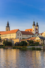 Fototapeta premium Castle and houses at the lake in Telc, Czechia