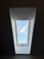 window blue sky with clouds