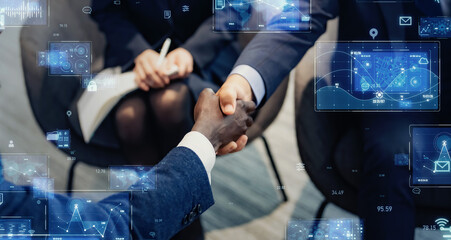 Business people shaking hands and digital technology concept