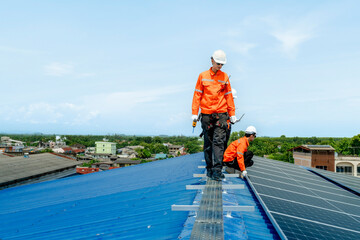 engineer man inspects construction of solar cell panel or photovoltaic cell by electronic device....