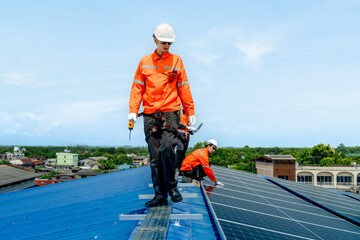 engineer man inspects construction of solar cell panel or photovoltaic cell by electronic device....