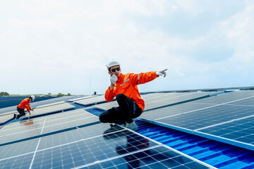 engineer man inspects construction of solar cell panel or photovoltaic cell by electronic device....