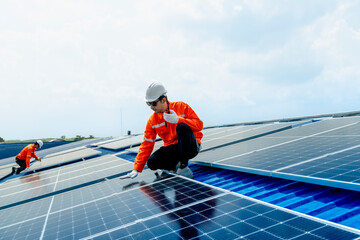 engineer man inspects construction of solar cell panel or photovoltaic cell by electronic device....