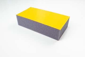 Polyurethane foam with adhesive layer. Sponge on self-adhesive base. Sponge with glue