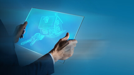 man in suit with house model