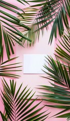 Tropical palm leaves frame on a pink background with blank white paper