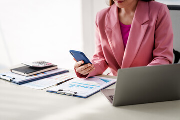 40-year-old middle-aged Asian businesswoman wearing pink suit, business finance, investment...