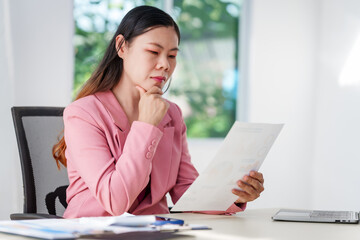 40-year-old middle-aged Asian businesswoman wearing pink suit, business finance, investment...