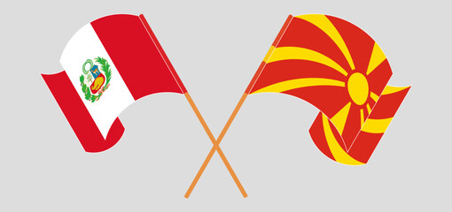 Crossed and waving flags of Peru and North Macedonia
