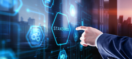 Businessman clicks Standards Quality assurance and control concept