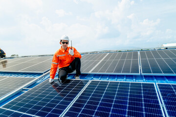 engineer man inspects construction of solar cell panel or photovoltaic cell by electronic device....