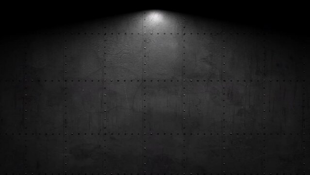 A dark background with gleaming metal studs receives a bright light from the top right corner, creating a striking contrast and highlighting the texture