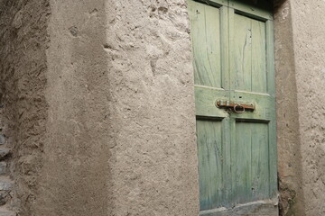 View of some details in an alley in the historic center of Pognana. Late Como, Italy 