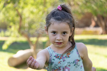 Empowered and Confident Girl Looking at Camera with Smile on a Warm Day